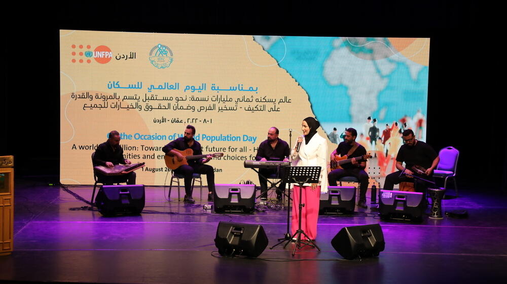 Nedaa Sharara performing at World Population Day event